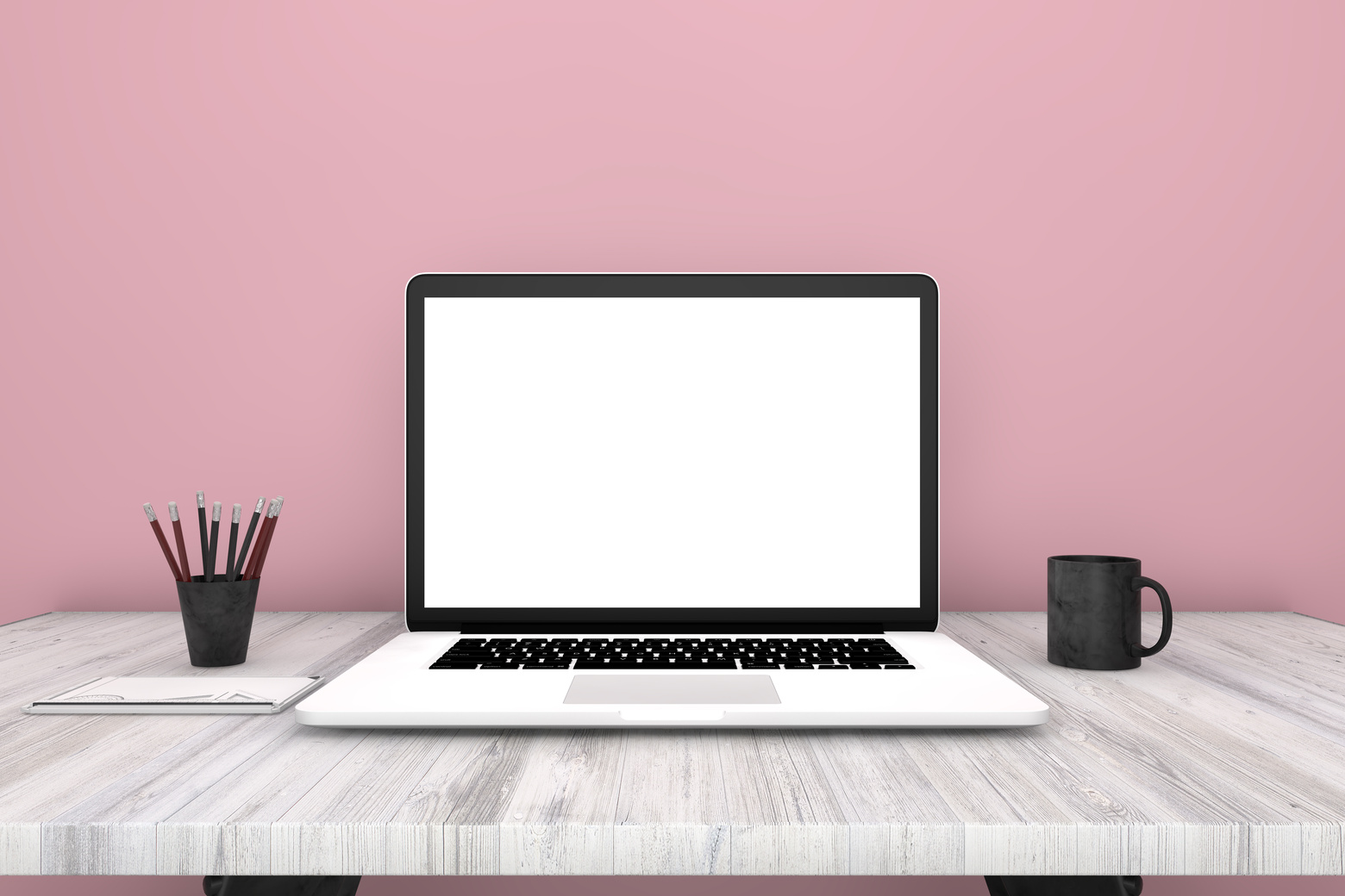 Laptop with blank screen on white desk